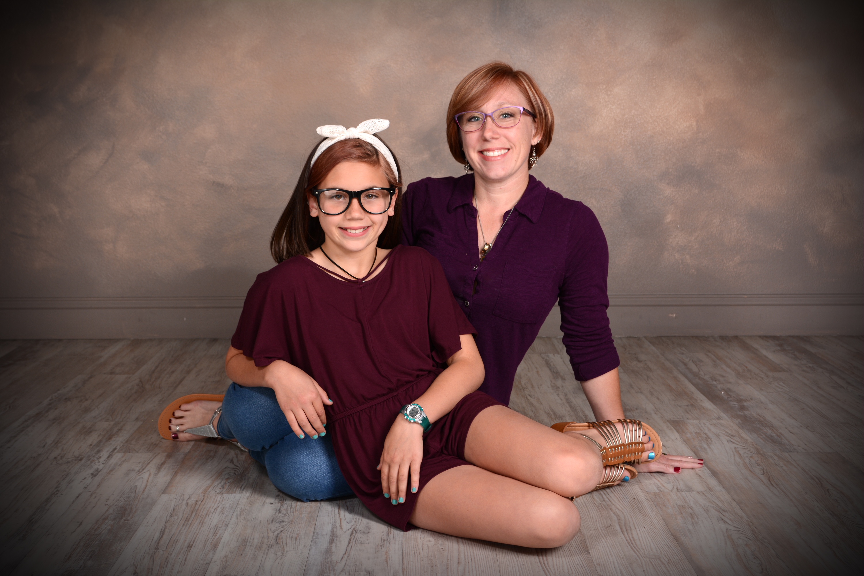 mother and daughter pose for professional studio portrait by Andrae Michaels in Colorado Springs